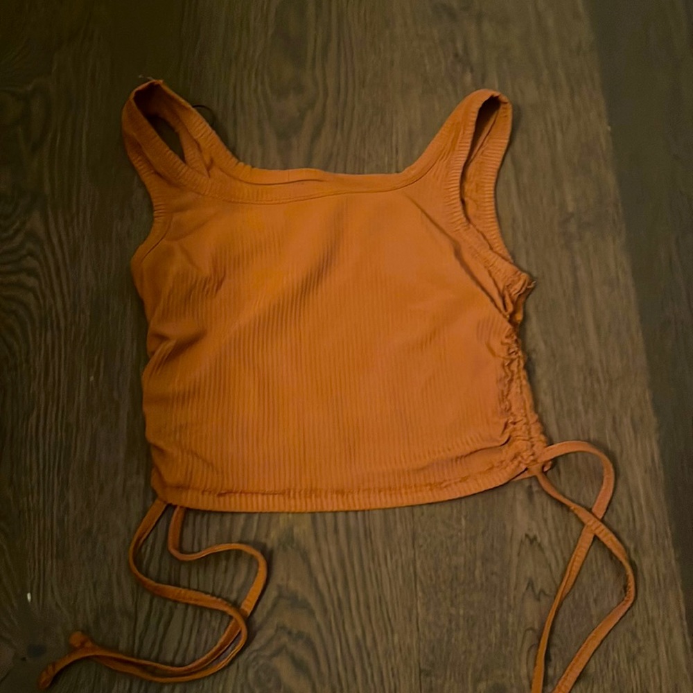 It’s a cute tank top and it’s never been worn